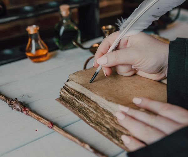 Ancient scroll and yoga symbols on a wooden table.
